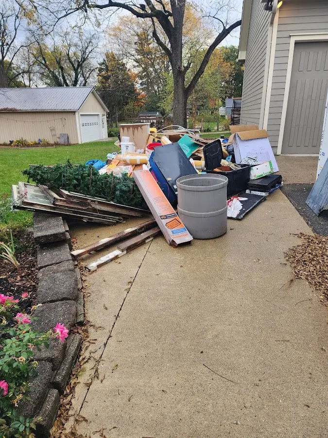 Dumpster being loaded with debris for 3 Yard Dumpster Rental in North Lakes